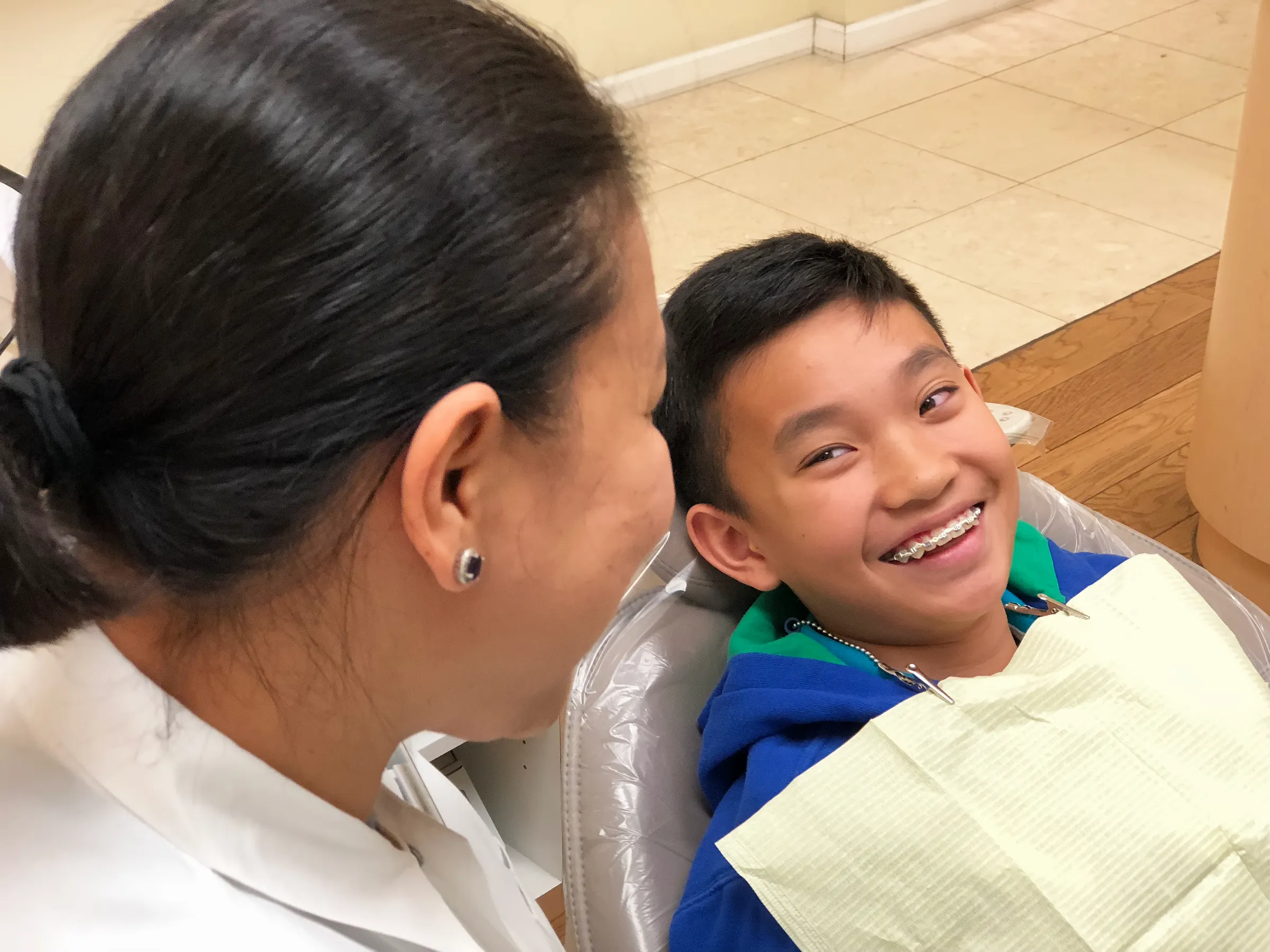 Dr. Chona talking with a patient during an appointment